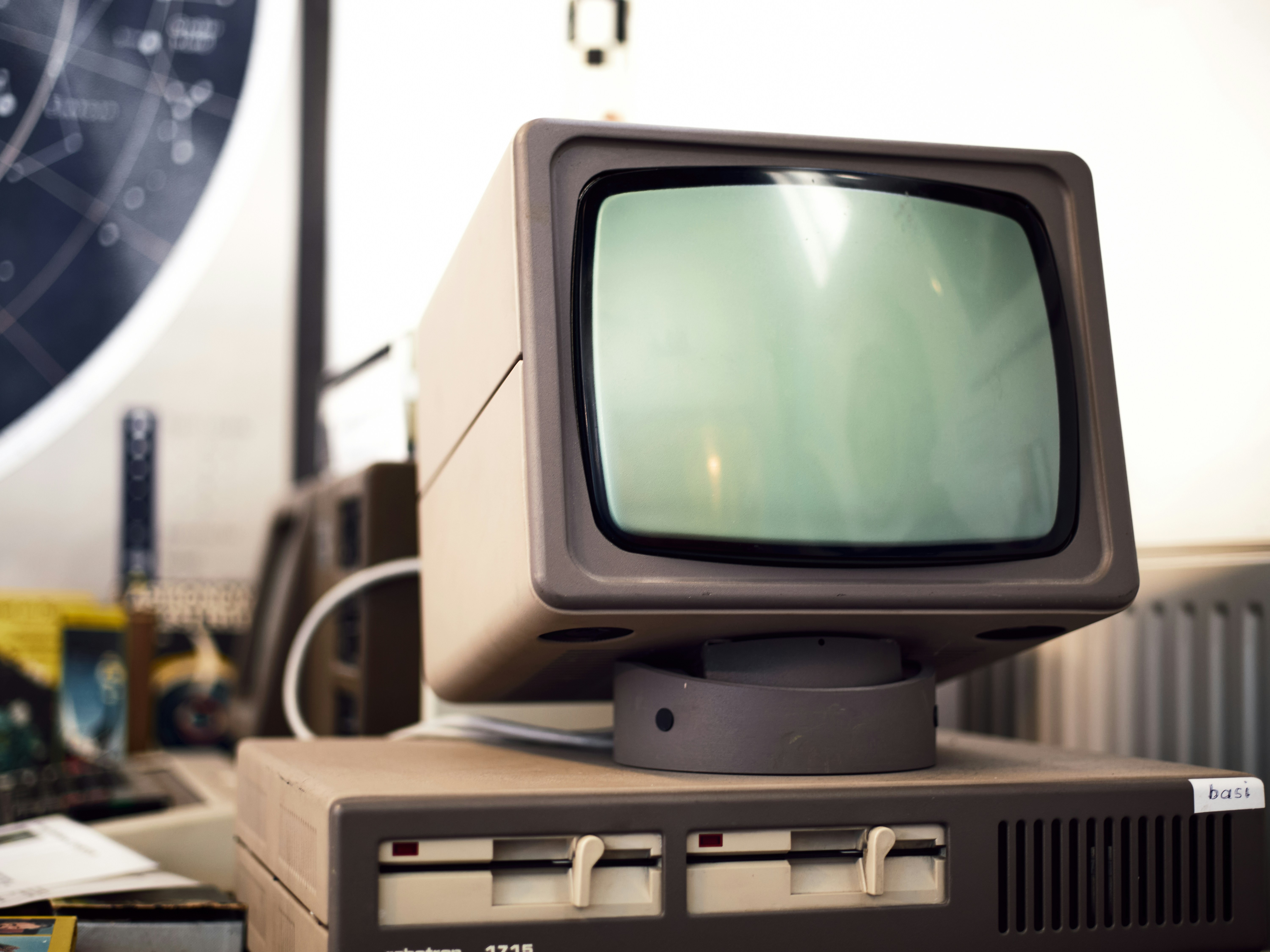 Old CRT monitor with floppy drives.